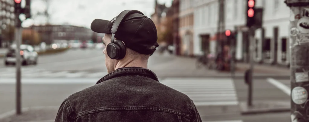Person wearing headphones listening on the go